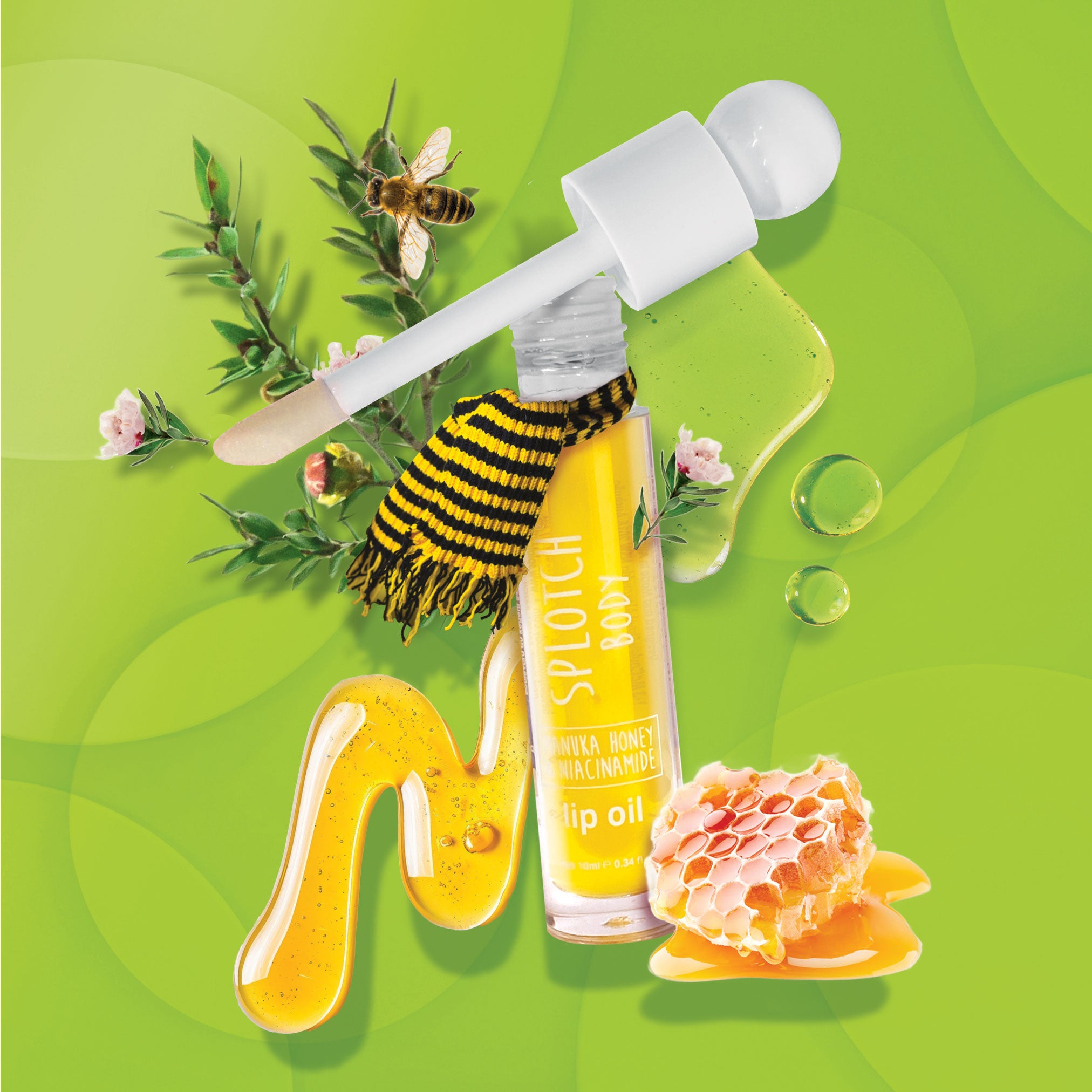 Bottle of lip oil with honeycomb, flowers, and a bee on a green background