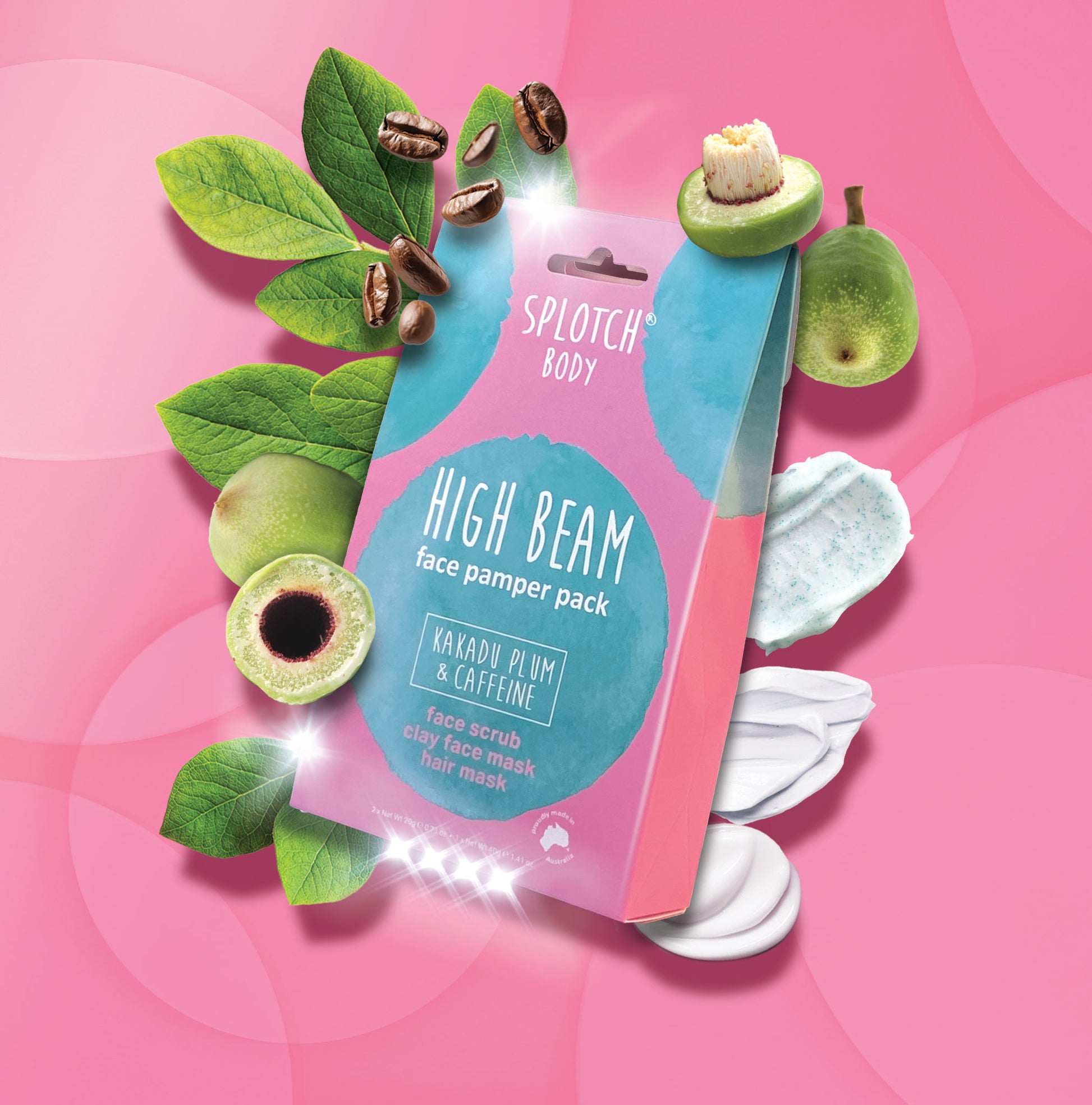 
A marketing product shot for the SPLOTCH BODY HIGH BEAM face pamper pack featuring a pink and teal box on a vibrant pink background. The box is labeled "KAKADU PLUM & CAFFEINE" and contains a face scrub, clay face mask, and hair mask. 