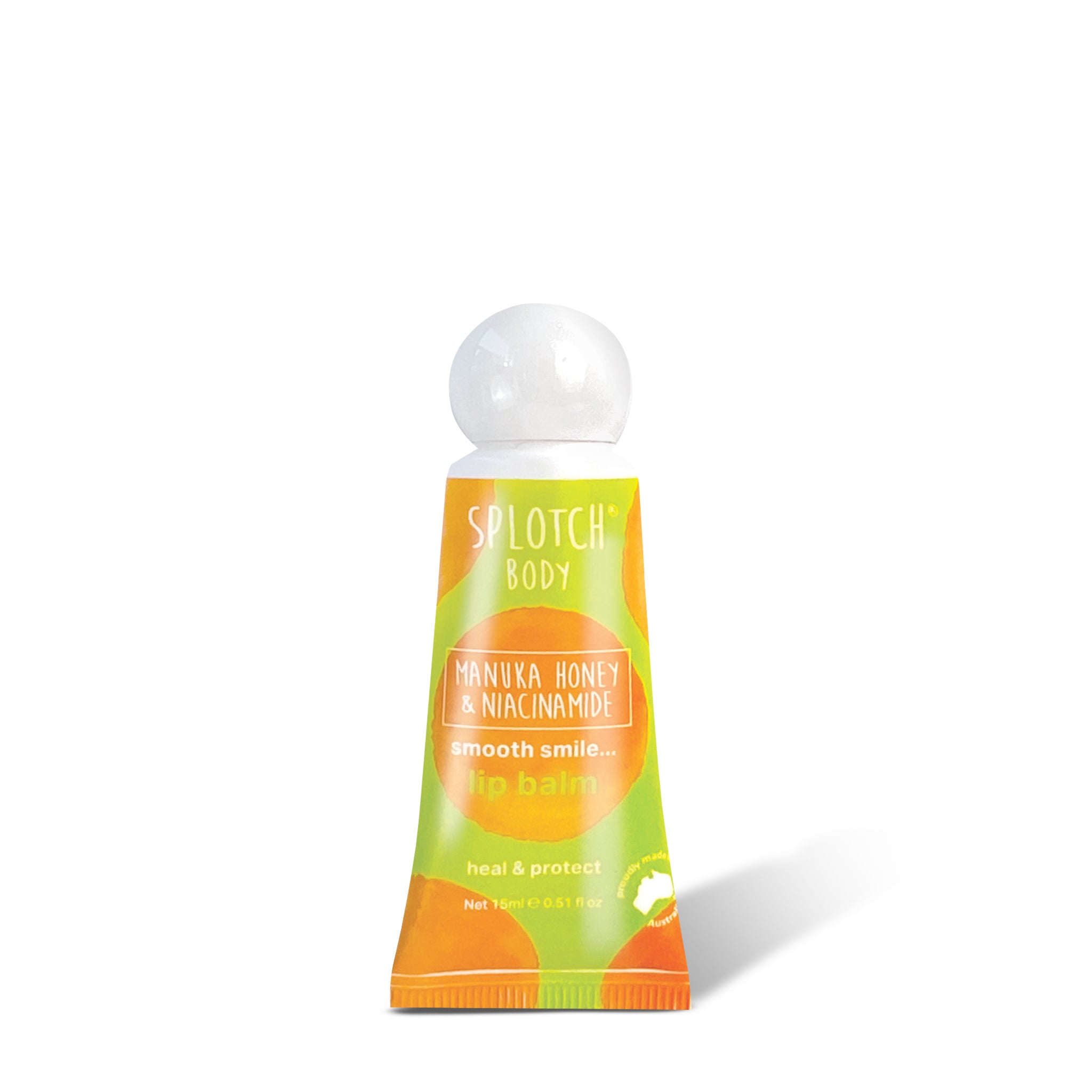A SPLOTCH BODY Manuka Honey & Niacinamide Lip Balm tube featuring a lime green and orange watercolor-patterned design with a white, spherical screw-on cap. The front of the squeeze tube describes the product as a "smooth smile... lip balm" designed to "heal & protect".