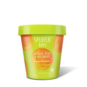 
A product shot of the SPLOTCH BODY Manuka Honey & Niacinamide Clay Face Mask tub, featuring a lime green design with orange watercolor splotches. The tub is labeled "pure dreams... clay face mask" and is formulated to "purify & soothe".