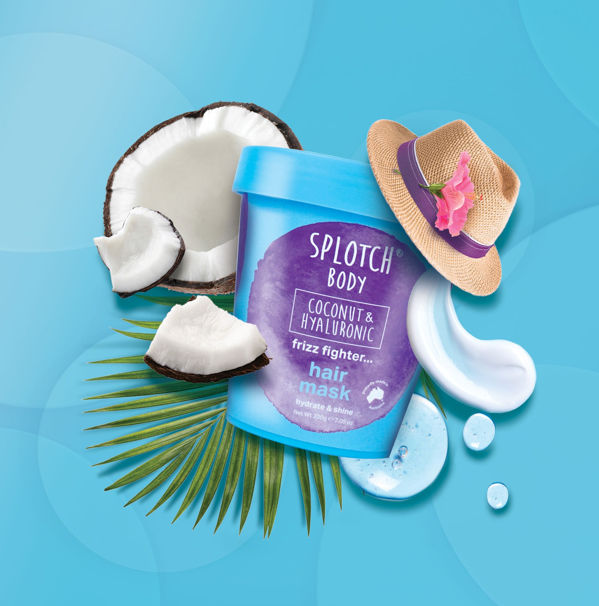 Splotch Body hair mask container with coconut pieces, a hat, and green leaves on a blue background