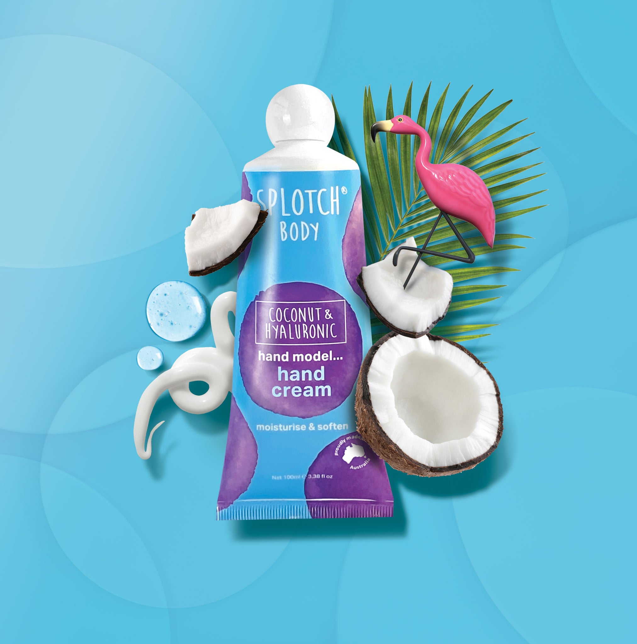 Splotch Body Coconut & Hyaluronic hand cream with coconut halves and a flamingo on a blue background