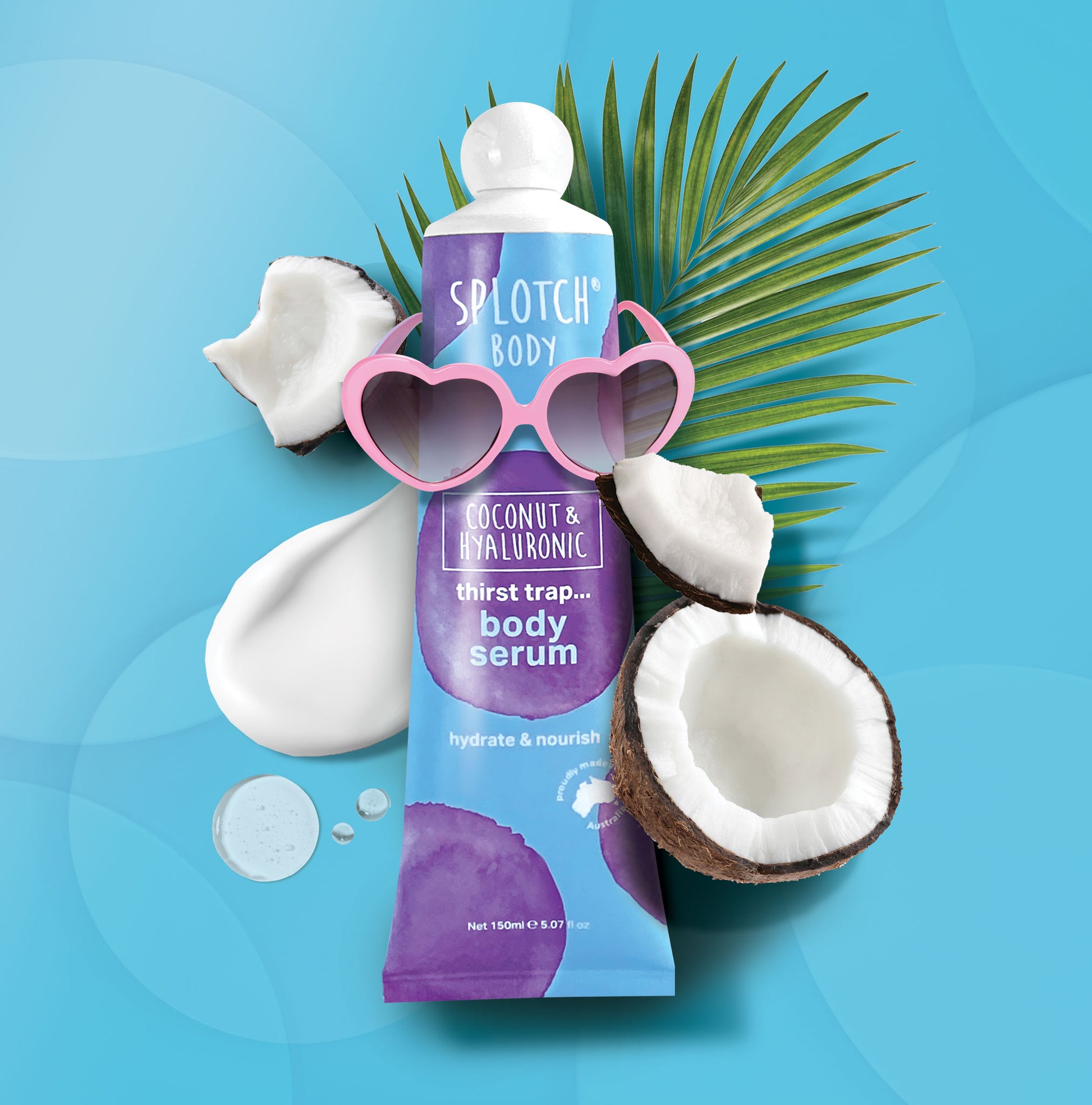 Splotch Body coconut and hyaluronic body serum with coconuts and sunglasses on a blue background