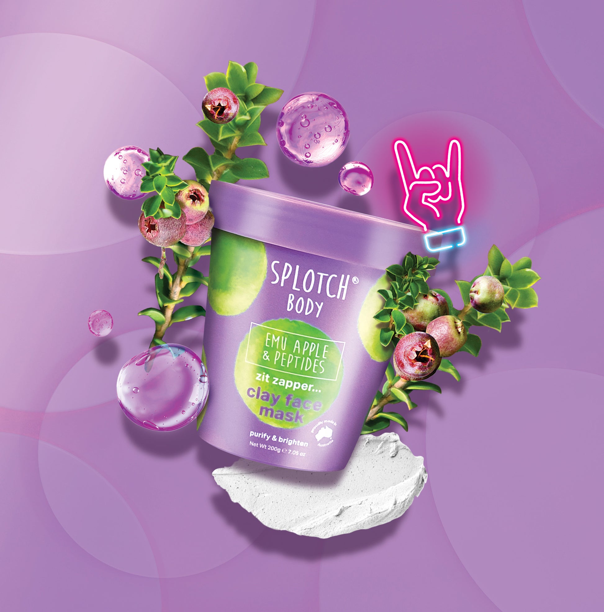 Product shot of a purple tub of SPLOTCH BODY Emu Apple & Peptides Clay Face Mask, featuring a bright green Emu Apple illustration on the label. The label text reads 'zit zapper... clay face mask' and 'purify & brighten'. The tub is surrounded by green branches with small purple berries, clear purple water droplets, and a small pile of white clay at the base, all set against a purple background with a neon pink 'rock on' hand sign.