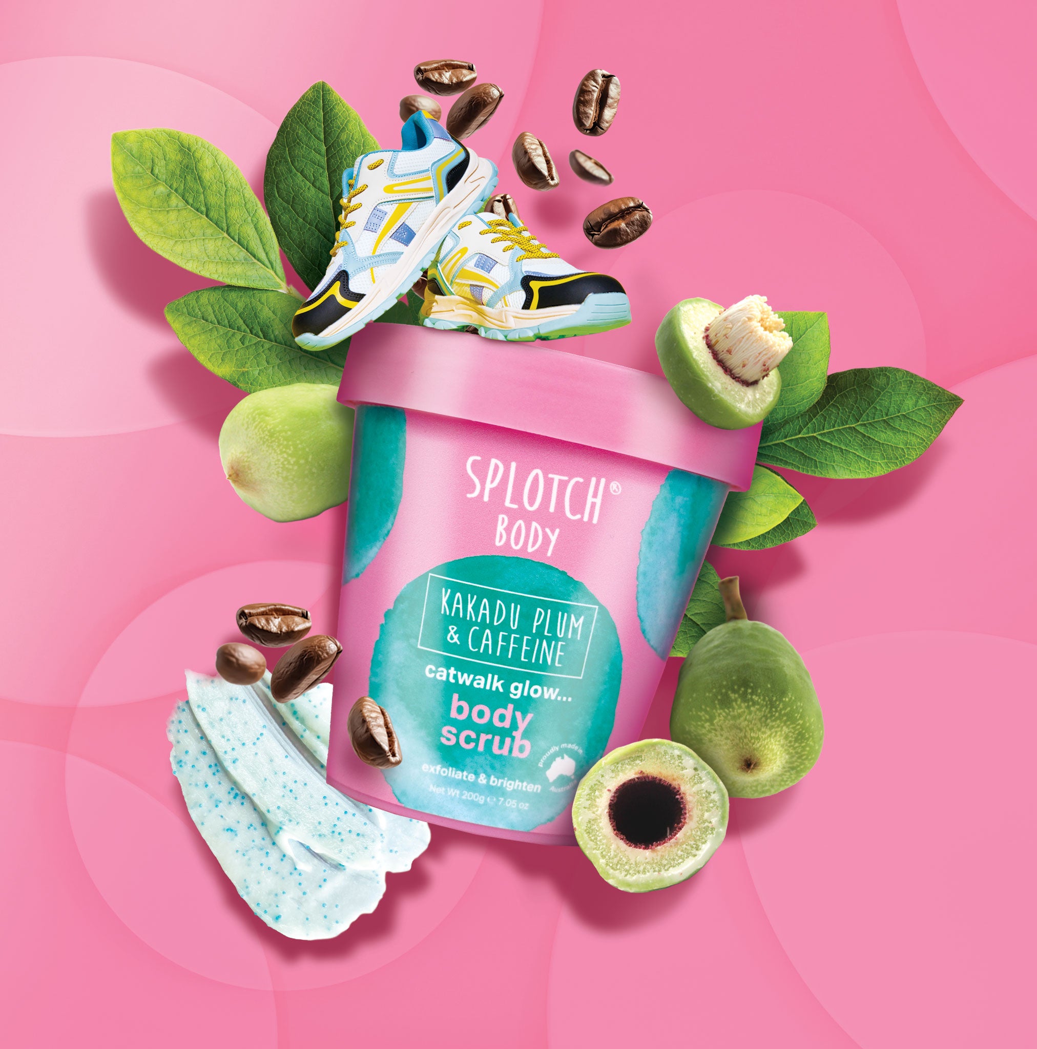 Splotch Body scrub packaging with fruits, leaves, and a shoe on a pink background